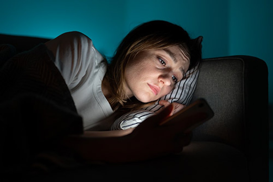 Woman using screen at night