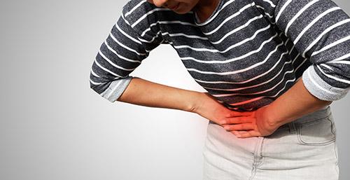 Woman with indigestion